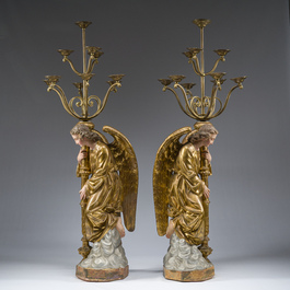 An impressive pair of polychrome decorated plaster angels mounted into ten-light candlesticks, 20th C.