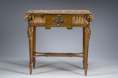 A French Louis XVI style gilt and carved woorden side table with ram's heads and a red marble top, 19th C.