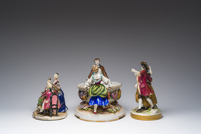 Two polychrome Saxon porcelain groups, a table piece and a cup and saucer, Germany, 19th/20th C.