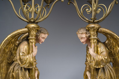 An impressive pair of polychrome decorated plaster angels mounted into ten-light candlesticks, 20th C.