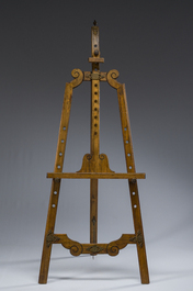 A carved walnut painter's easel with brass mounts, early 20th C.
