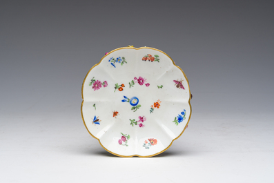 Two polychrome Saxon porcelain groups, a table piece and a cup and saucer, Germany, 19th/20th C.