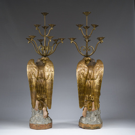 An impressive pair of polychrome decorated plaster angels mounted into ten-light candlesticks, 20th C.