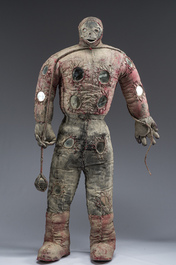 A Haitian Bizango statue of a male warrior with a sling in his hand, mixed media, 20th C.