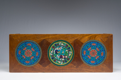 A Chinese rectangular wooden table inlaid with three round cloisonn&eacute; plaques with floral design, 20th C.