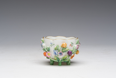 Two polychrome Saxon porcelain groups, a table piece and a cup and saucer, Germany, 19th/20th C.