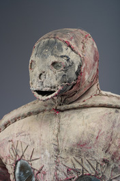 A Haitian Bizango statue of a male warrior with a sling in his hand, mixed media, 20th C.