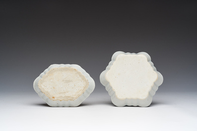 A Chinese blue and white box and cover with floral design, a teapot stand and a famille rose 'Mandarin' spoon tray, Kangxi/Qianlong