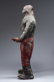 A Haitian Bizango statue of a male warrior with a firearm in his hand, mixed media, 20th century