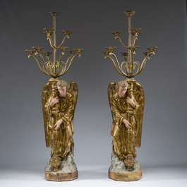 An impressive pair of polychrome decorated plaster angels mounted into ten-light candlesticks, 20th C.