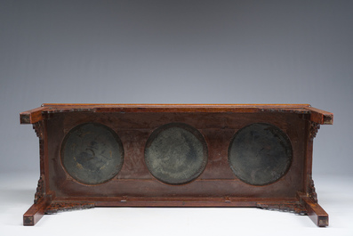 A Chinese rectangular wooden table inlaid with three round cloisonn&eacute; plaques with floral design, 20th C.