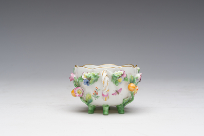 Two polychrome Saxon porcelain groups, a table piece and a cup and saucer, Germany, 19th/20th C.