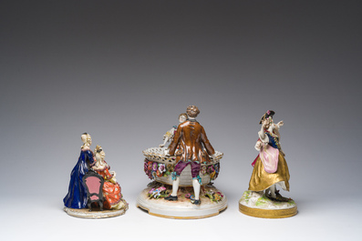 Two polychrome Saxon porcelain groups, a table piece and a cup and saucer, Germany, 19th/20th C.