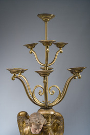 An impressive pair of polychrome decorated plaster angels mounted into ten-light candlesticks, 20th C.