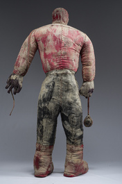 A Haitian Bizango statue of a male warrior with a sling in his hand, mixed media, 20th C.