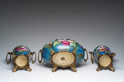 A French three-piece polychrome faience fine bronze mounted garniture with floral design, Creil Montereau Boulenger et Cie, 19th C.