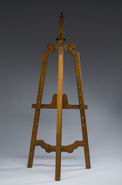 A carved walnut painter's easel with brass mounts, early 20th C.