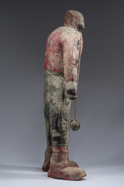 A Haitian Bizango statue of a male warrior with a sling in his hand, mixed media, 20th C.