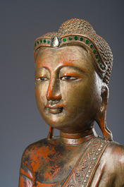 A tall Thai inlaid gilt lacquered wooden figure of a standing Buddha, 20th C.
