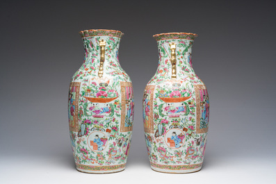 A pair of Chinese Canton famille rose vases with palace scenes and floral design, 19th C.