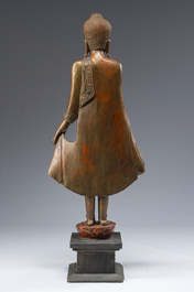 A tall Thai inlaid gilt lacquered wooden figure of a standing Buddha, 20th C.