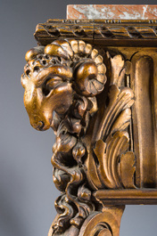 A French Louis XVI style gilt and carved woorden side table with ram's heads and a red marble top, 19th C.