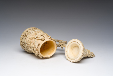 A German ivory mug and cover or tankard with relief design of 'Bacchanalia' scenes and satyrs, ca. 1880