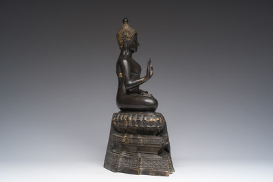 A Thai bronze sculpture of the seated Buddha with traces of gilding, Rattanakosin, 18th/19th C.