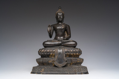 A Thai bronze sculpture of the seated Buddha with traces of gilding, Rattanakosin, 18th/19th C.