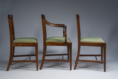 A set of six English mahogany chairs and two armchairs upholstered in green fabric, 19th C.