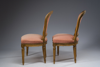 A pair of French Transition carved beechwooden chairs with old pink upholstery, 18th C.