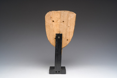 An Egyptian wooden sarcophagus mask with white stucco and black accents, Late Period, 6th-1st C. b.C.