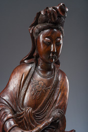 A large Chinese carved wooden figure of Guanyin with children, 20th C.