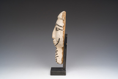 An Egyptian wooden sarcophagus mask with white stucco and black accents, Late Period, 6th-1st C. b.C.