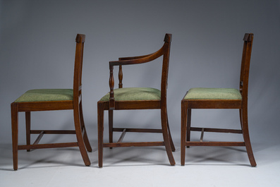 A set of six English mahogany chairs and two armchairs upholstered in green fabric, 19th C.