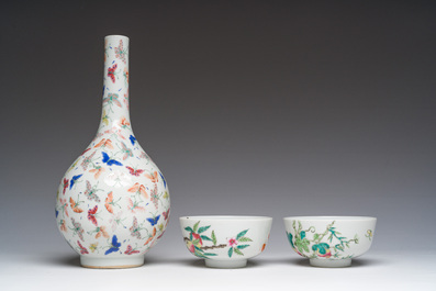 A Chinese famille rose '100 butterflies' vase and two bowls with peaches and balsam pears, Qianlong mark, 20th C.