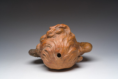 A polychromed terracotta cherub head, probably France, 18th/19th C.