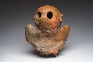 A polychromed terracotta cherub head, probably France, 18th/19th C.