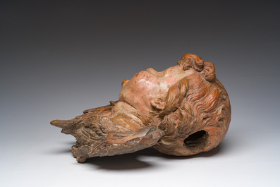 A polychromed terracotta cherub head, probably France, 18th/19th C.