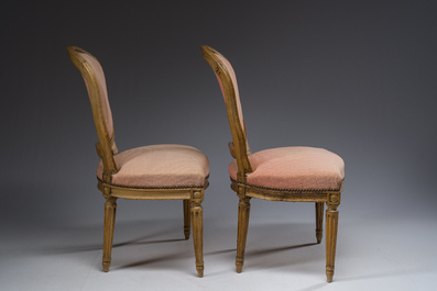 A pair of French Transition carved beechwooden chairs with old pink upholstery, 18th C.