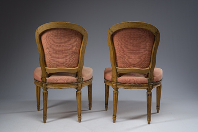 A pair of French Transition carved beechwooden chairs with old pink upholstery, 18th C.