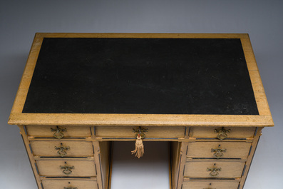 An English nine-drawers wooden pedestal desk with ebonized wooden inlay and leather top, Garnett &amp; Sons, ca. 1900