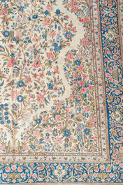 A Persian Kerman (Kirman) rug with floral design, wool on cotton, 20th C.