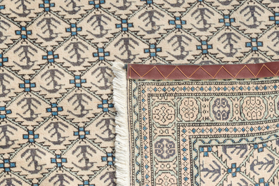 A Turkmen rug with geometric design, wool on cotton, 20th C.