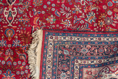 A Persian Bidjar rug with floral design, wool on cotton, 20th C.