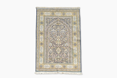 A Persian Qom (Qum/Ghom) silk rug with floral design and calligraphy, Mahneb, third quarter 20th C.