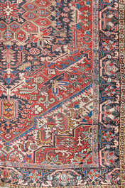 A Persian Heriz rug with floral design, wool on cotton, 20th C.