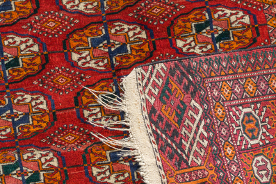 Two Persian and one Afghan rug with geometric design, wool on cotton, 20th C.