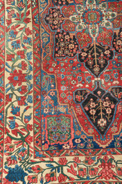 A Persian Bakhtiar rug with floral design, wool on cotton, 20th C.