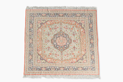 A Chinese silk Hereke style rug with floral design, 20th C.